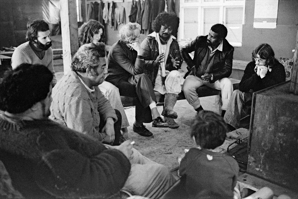 John Miller Takaparawhau Bastion Point Arohanui interior, including Reverend George Armstrong, Colin Clark, Father Walter Lini, Phil Goff 1977. Photograph. Courtesy of the artist